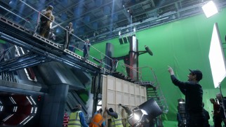 J.J. Abrams directs his cast on an elevated set in front of green screen in "The Secrets of 'The Force Awakens': A Cinematic Journey."