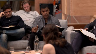 The cast is comfortably seated for a "table" read.