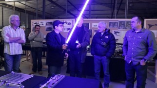 Director J.J. Abrams tests out a practical lightsaber in "Inside the Armory."