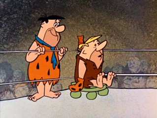 Fred is in Barney's corner as he has to fight a boxing champion in "The Engagement Ring."