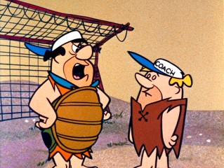 Umpire Fred and coach Barney argue in "Take Me Out to the Ball Game."