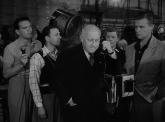 Accomplished director Cecil B. DeMille appears as himself to reluctantly meet with Norma Desmond while shooting a picture.