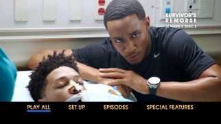 Cam (Jessie T. Usher) tries not to look uncomfortable posing for a picture with a kid in a coma on the Survivor's Remorse Disc 2 main menu.