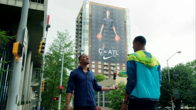 Reggie Vaughn (RonReaco Lee) and Cam Calloway (Jesse T. Usher) take in the sight of a 13-story Nike billboard featuring Calloway in "Survivor's Remorse."