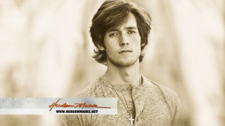 The music video for "Cold Grey Light of Dawn" plays the end credits song over this Hudson Moore headshot.