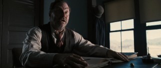 Supporting the Coen Brothers vibe, Stephen Root plays Hugh, a banker who swindles the Ramirezes with some period racism.