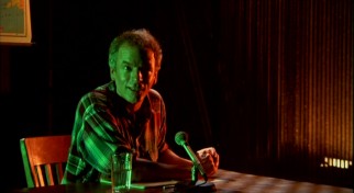 Jonathan Demme bathes Spalding Gray in red and green light for one dramatic passage from the film.