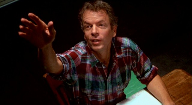 Spalding Gray acts out Cambodians waving goodbye to departing American helicopters in his 1987 monologue film "Swimming to Cambodia."