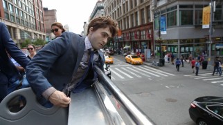 A dead Daniel Radcliffe dummy takes in the sights of New York City from a tour bus' upper deck in "Making Manny."