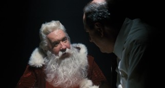 Subjected to the bright light of a police interrogation, Kris Kringle (Tim Allen) drops a number of aliases, among them Sinterklaas, Pere Noel, and Topo Gigio.