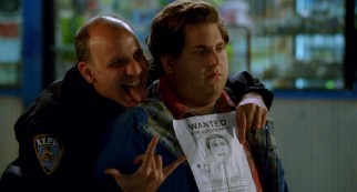Officer Frank (Nick Sandow) takes a celebratory photo with Noah (Jonah Hill) and his police sketch.