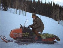 Slow-witted neighbor Wally shows off his snowmobile, made from scraps.