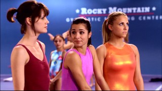 Emily (Chelsea Hobbs, left), the new gymnast at the Rock, is welcomed by Kaylie (Josie Loren) but shunned by Lauren (Cassie Scerbo) in the included "Make It or Break It" pilot episode.