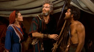 Moses (Charlton Heston) shares few specifics of his fiery God chat with Joshua (John Derek) and Lilia (Debra Paget).