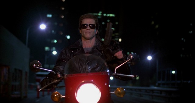 Wearing his sunglasses at night, the Terminator (Arnold Schwarzenegger) is relentless in his pursuit of Sarah Connor.