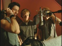 An anonymous boy band singing "Three is a Magic Number."