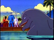 Mr. Smarty Pants isn't so sweet anymore. This intelligent dolphin looks menacingly towards Tick, Arthur, and his trainers Soren and Fred.