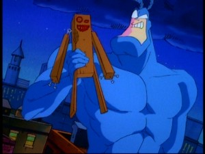 The Tick shows off his new pal, the lovely wooden boy he made on a Hobby Night spent alone.