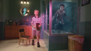 As Sharkboy, young Taylor Lautner keeps in a shark tank while Max (Caden Boyd) looks concerned.