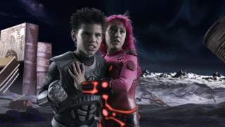 Sharkboy (Taylor Lautner) and Lavagirl (Taylor Dooley) are part of the 3-D Land of Milk and Cookies.