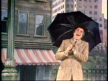 Impressionist Rich Little recreates a memorable scene from "Singing in the Rain."