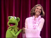 Cloris Leachman has the luck to appear on an episode when pigs take over The Muppet Show. Here, she smiles with the porcine stand-in for Kermit.