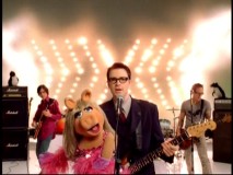 Miss Piggy, penguins, and many unseen Muppets accompany Weezer in their delightful 2002 music video for "Keep Fishin'."