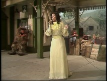 Country legend Loretta Lynn sings in a train station, the temporary home of the "Muppet Show" while the usual theater is fumigated. 