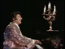 Liberace glitters while making eyes at a seductive candelabra.