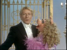 Danny Kaye enjoys a dance with an adoring Miss Piggy.