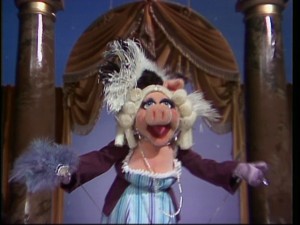 Miss Piggy hams it up in true Piggy fashion.
