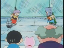 The principal's wife and the samurai lunch lady duel it out. Yes, you see correctly. The wife has a vaccuum and the lunch lady is wearing a pot for a mask.