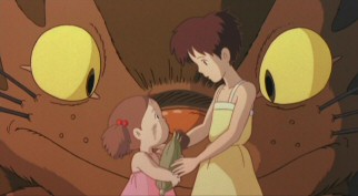 Mei explains to Satsuki her mission of delivering the ear of corn to their mother as the catbus looks on.
