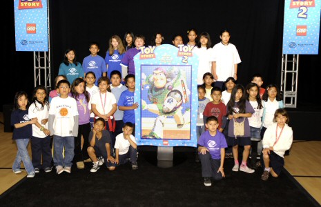 The children of the Hollywood Boys & Girls Club pose by their finished Buzz section.