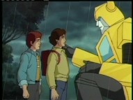 This sad little boy's decision to run away from home has caught the attention of Bumblebee. If the boy were smart, he'd continue his plans in order to meet more Transformers.
