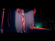 Yuri (Cindy Morgan) lights up a room with a flowing robe in this sexy deleted "Tron" scene.