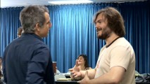 A much longer and darker-haired Jack Black chats with a silver-haired Ben Stiller at a table read in "Before the Thunder."