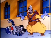 Unbeknownst to him, "Bullethead Baloo" thwarts a robot who poses a genuine threat outside the Khan Industries building.