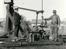 1920s folks pump for oil in the silent short film "The Story of Petroleum."