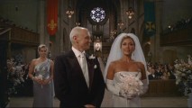 It's "A Nice Day for a Posh Wedding" as Bradford and Wilhelmina get ready to exchange their vows in front of a large audience.