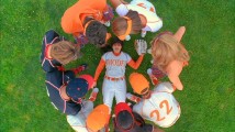 After getting knocked out by a softball, Betty finds herself surrounded by a mix of concerned and amused people.