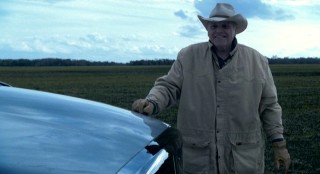 Rancher Gus (Brian Dennehy) is part of the first character-building challenge: manual labor in Texas.