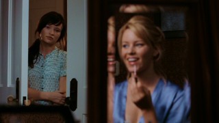 Anna (Emily Browning) cautiously prepares to call out a characteristically pleasant Rachel (Elizabeth Banks).