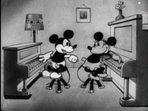 Mickey plays his newly-received piano, and Minnie plays her for the musical gaiety of "The Birthday Party."