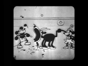 Mickey and Minnie revel in musical fun in "Steamboat Willie", their debut short.