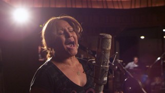 Darlene Love gets to sing lead in the film's fitting closing performance of "Lean on Me."
