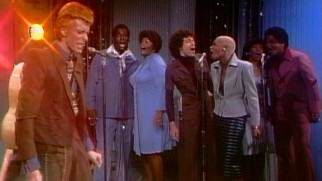 David Bowie's "Young Americans" is cited as an example of song that makes prominent use of backup singers.