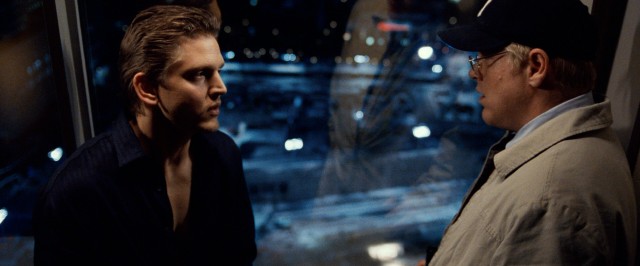 Frank Slaughtery (Barry Pepper) and Jacob Elinsky (Philip Seymour Hoffman) discuss their mutual friend's bleak future while overlooking Ground Zero clean-up and identification efforts at the site of the former World Trade Center.