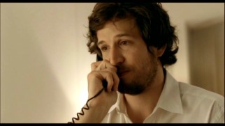 Traveling businessman Jean-Paul Clement (Guillaume Canet) makes a call for companionship in the bonus 2008 short "Voyage d'affaires."