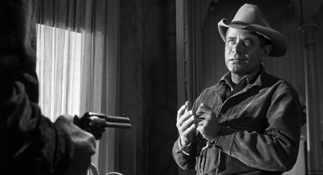 Outlaw Ben Wade (Glenn Ford) is holed up in a Contention City hotel room awaiting transfer on the "3:10 to Yuma" in this 1957 Western.
